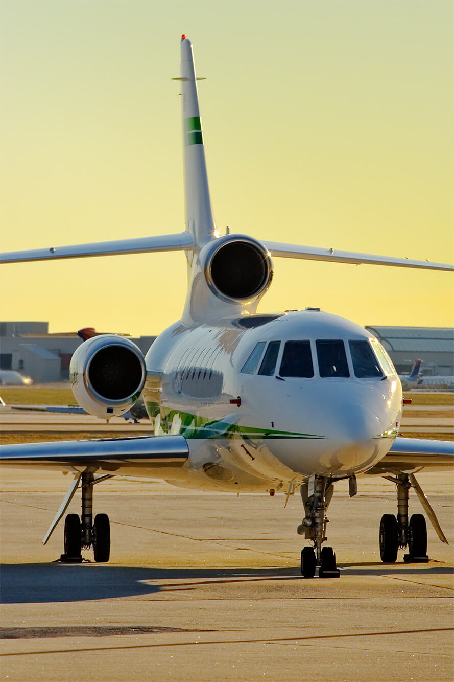 Business jet on the ramp at sunrise